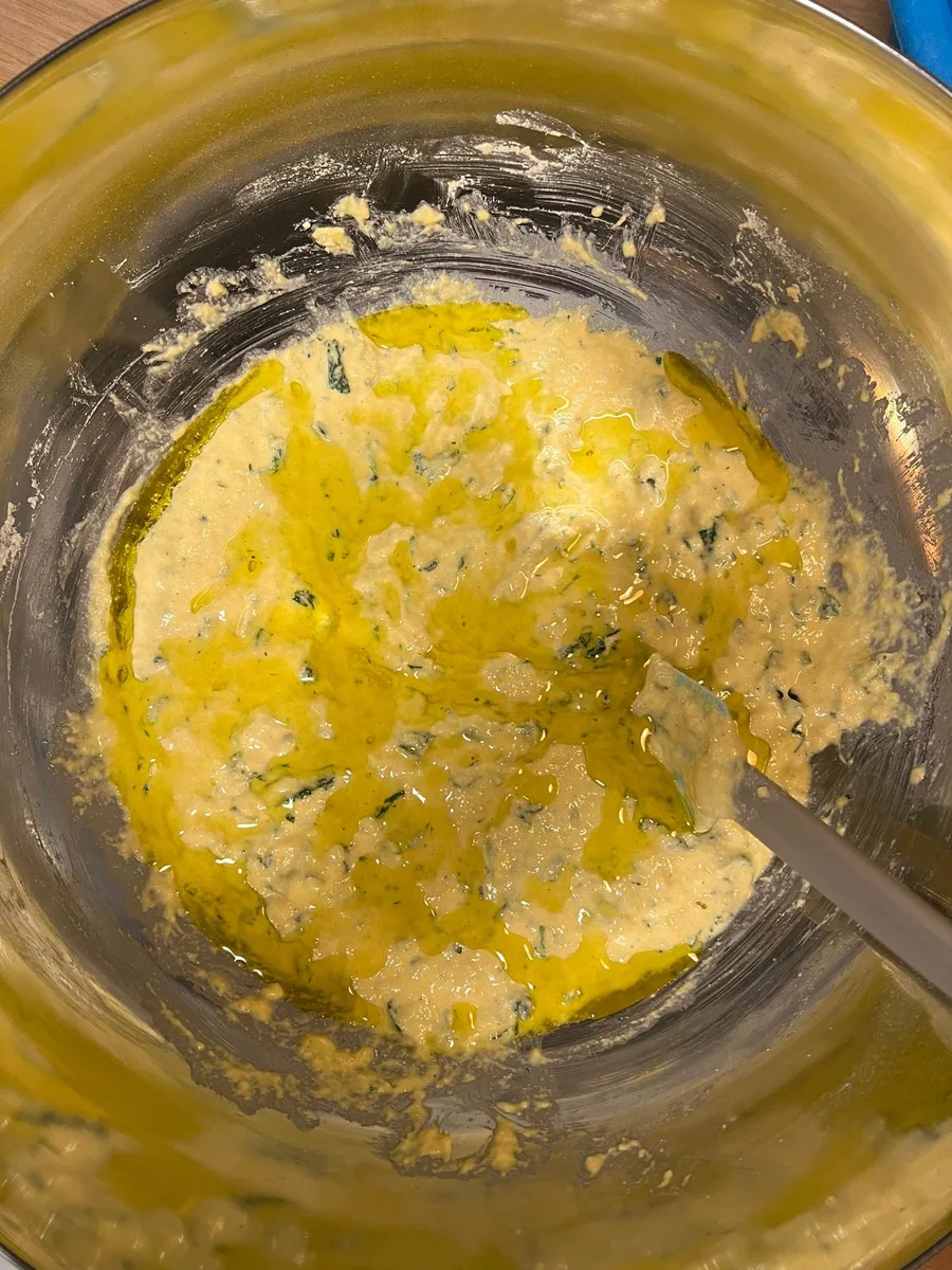 Adding olive oil to the dough